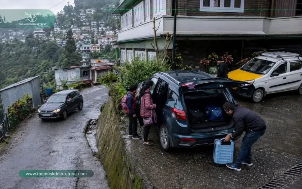 Budget hotels in Gangtok parking and taxi access scene on a steep hillside road